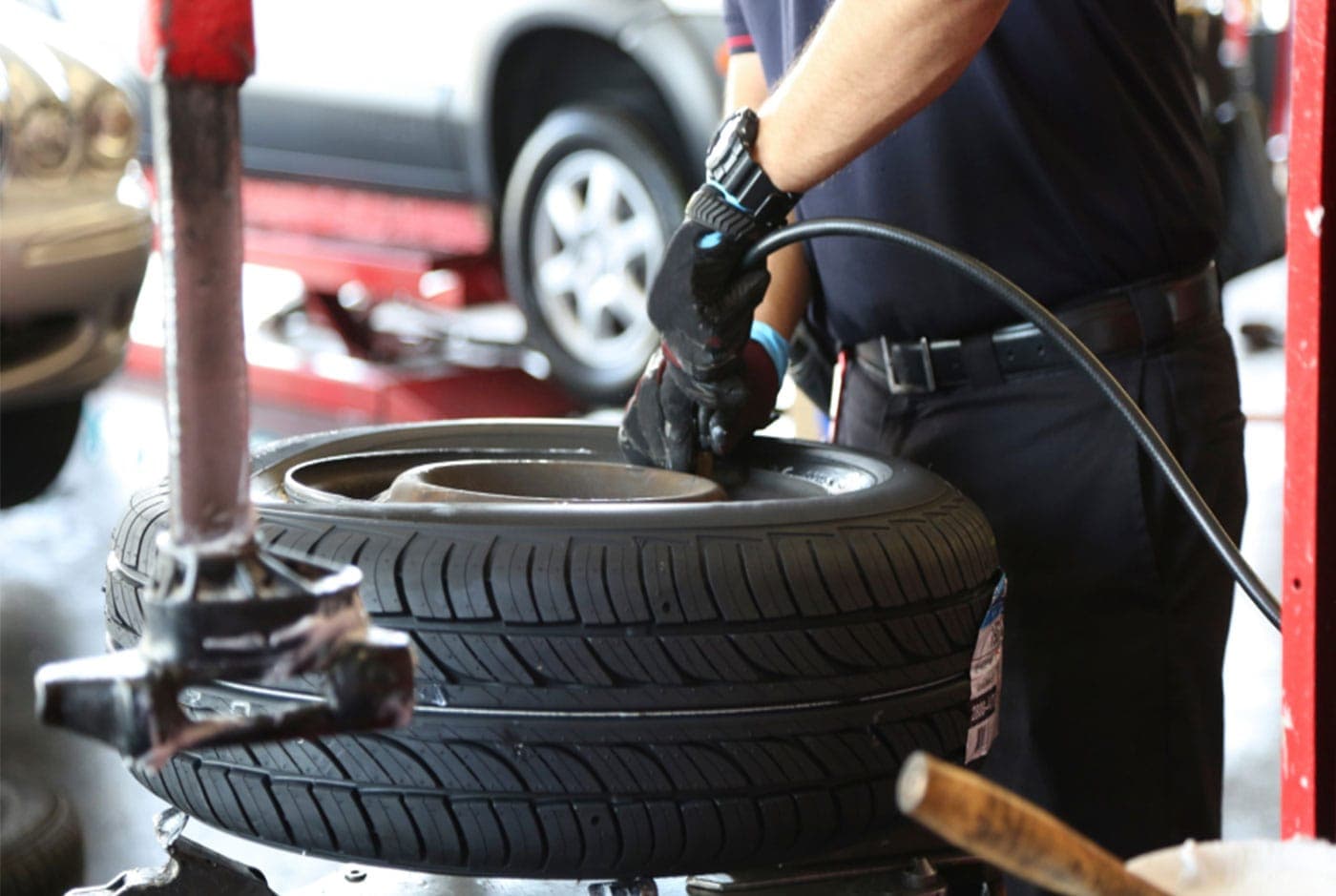 Four-wheel alignment being performed at Boss Tire
