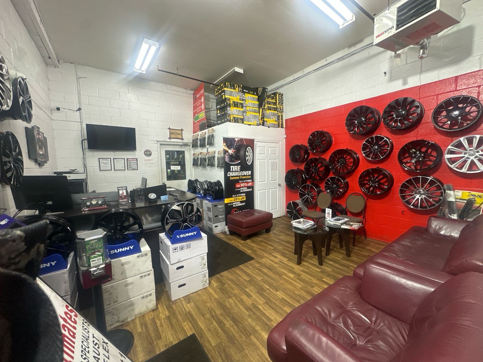 Inside the Boss Tire showroom on Danforth Rd, wheel display and waiting area