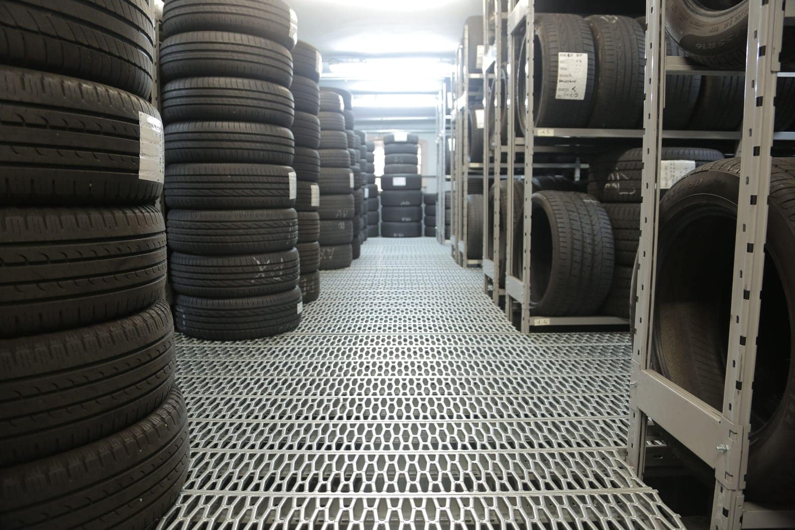 Rows of new and used tires stocked in the shop